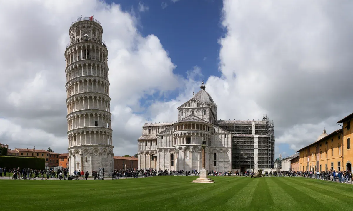 The Leaning Tower of Pisa beside the cathedral on the lawn of the Piazza dei Miracoli, the extra stop on Florence and Pisa tours from Rome